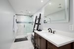 Totally renovated master bath with internally lighted mirror and walk in shower.